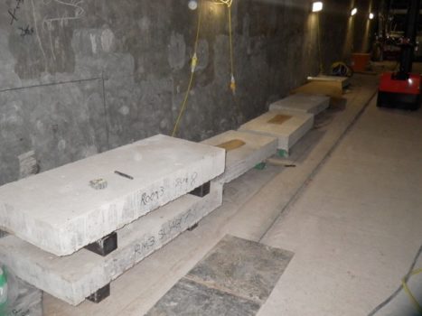 Large fabricated concrete blocks, smooth slabs containing rebar or cut out blocks with rebar